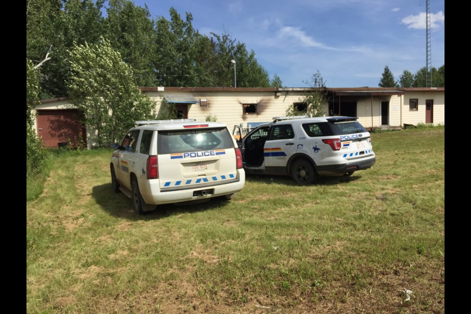 RCMP vehicles remained at the scene of Satruday morning's blaze at the school division warehouse on 105 Street.