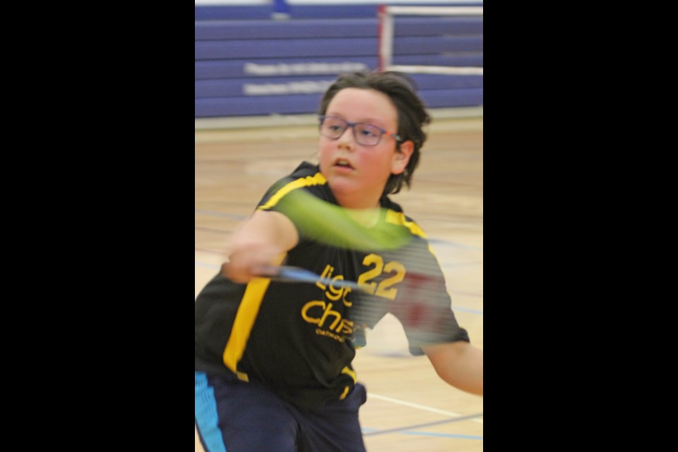 Grade 6 Light Of Christ badminton player Kale Cardinal moves quickly towards a shot during last Wednesday's junior high school Wards. 