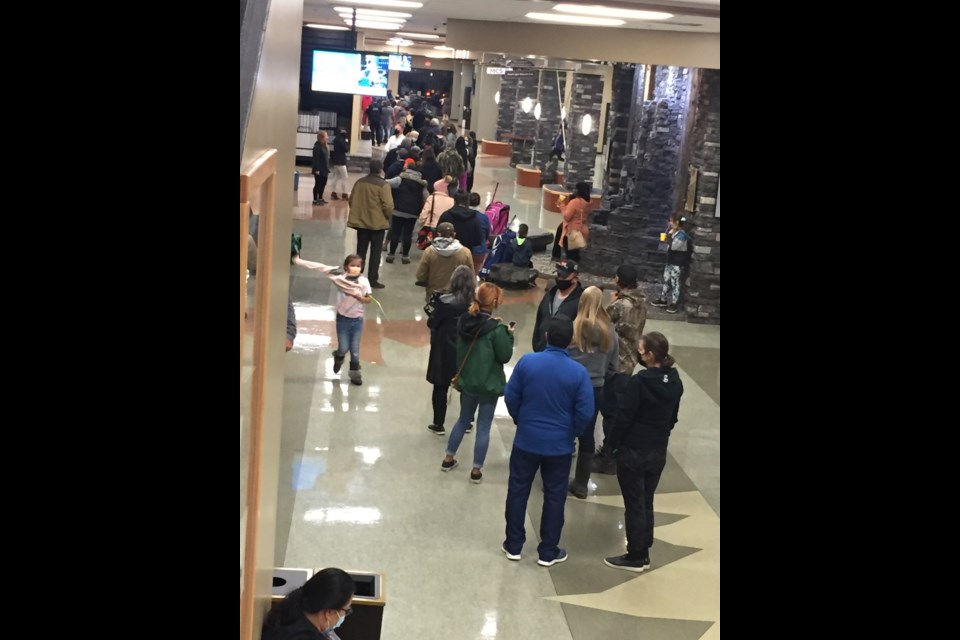 With an hour to go before polls close, dozens of people were still waiting in line at the Bold Center polling station. 