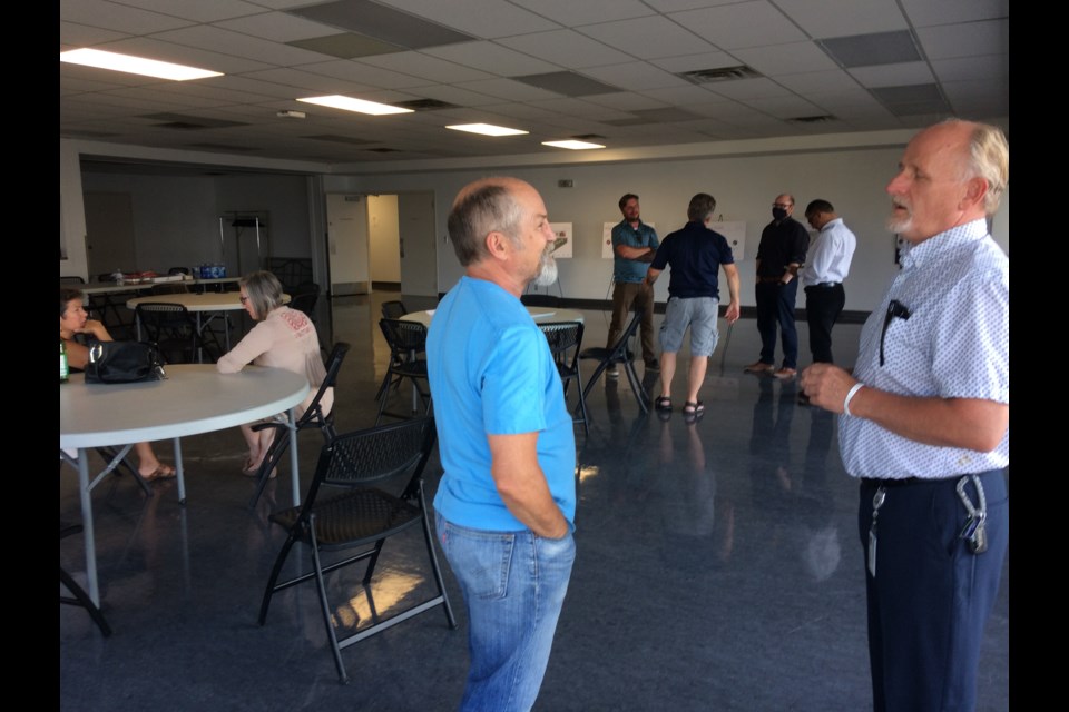 Lac La Biche's Marvin Straus speaks to the County's John Usher during Wednesday night's Q&A session on the downtown revitalization project. Only two community residents attended the event. 