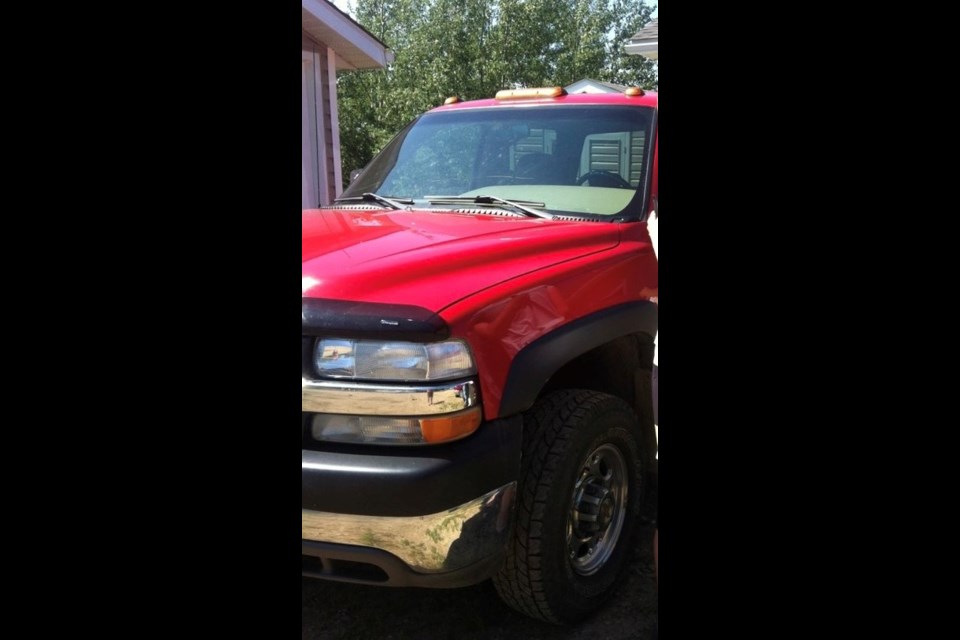 RCMP are looking for this truck, a red Chev Silverado with Alberta licence plate BCZ8292. Police say the owner of the vehicle was dragged behind it and possibly run over during a reported theft on November 23.