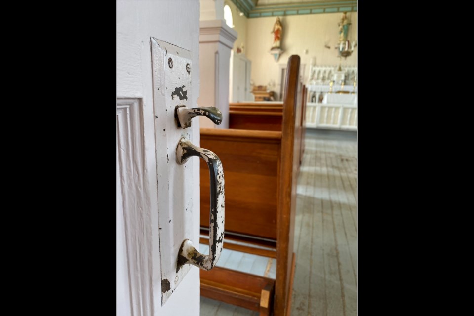 The door panels, hinges, handles, the wooden floor slats and wall panels have all been renovated to best replicate the original, 100 year old history of the old church at the Lac La Biche Mission Historical Site.