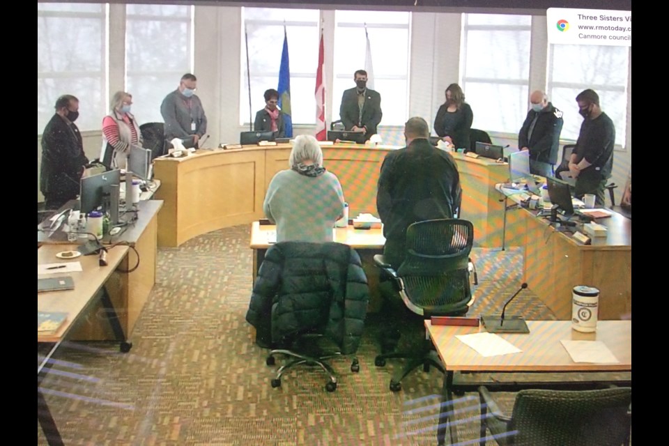 Metis Nation of Alberta President Audrey Poitras (centre-left) and MNA Region 1 President Jim Cardinal (centre-right) stand with Lac La Biche County council as an Indigenous prayer is read to start Wednesday's special council meeting about a short-term solution for some local homeless residents. 