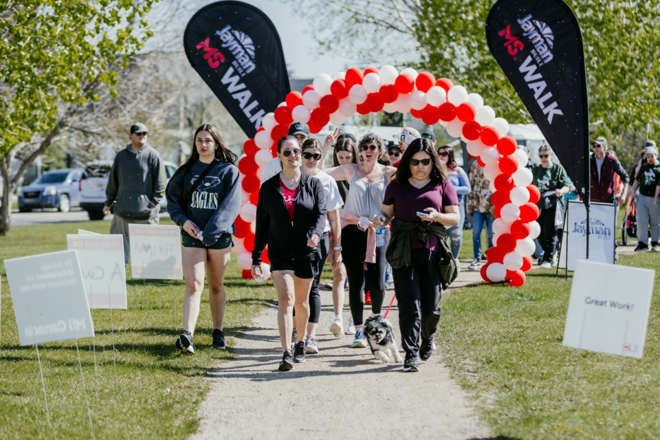 Participants walked through a balloon arch at the start of the MS Walk.