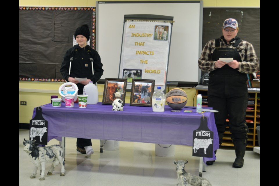 Shyanne and Shaylyn Klatt were all dressed to get on with the chores, and with their demonstration that raising cattle, including both beef and dairy, is indeed an industry that impacts the world. / Vicki Brooker photo