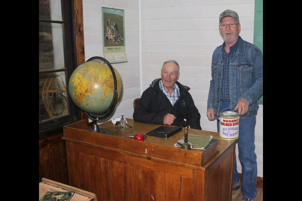 Fred Gratton and Clem Fontaine of the People’s Museum Society of St. Paul and District take a step back in time in the one-room schoolhouse they recreated at the St. Paul Historical Museum. An open house is being held Sunday as the museum kicks off its summer season and area residents are invited to take a trip down memory lane. 
Clare Gauvreau photo