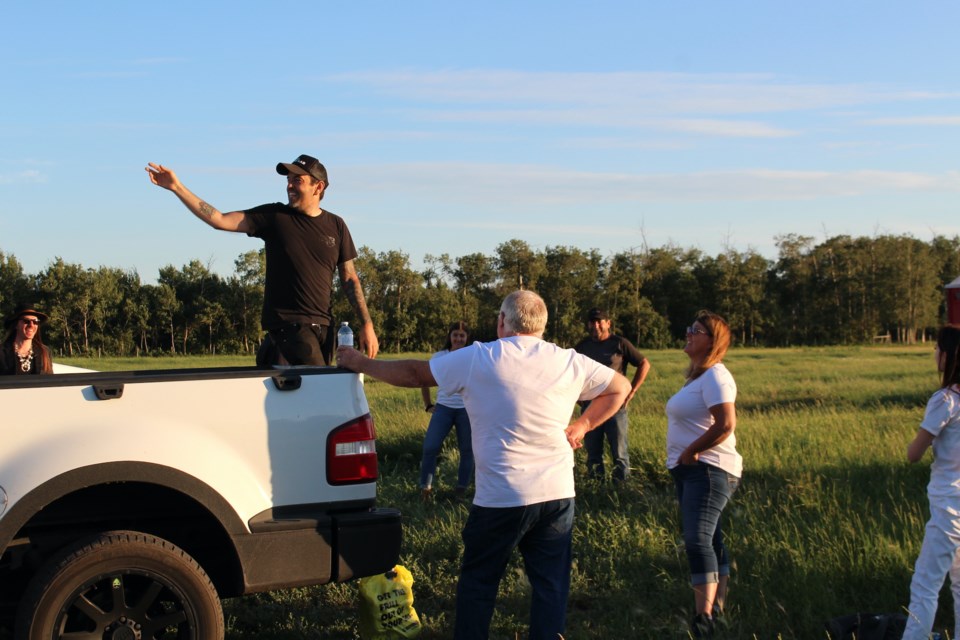 Director Travis Nesbitt explains to the extras what they’re going to do for the Lie to Me music video shoot in Bonnyville on Saturday, July 24.