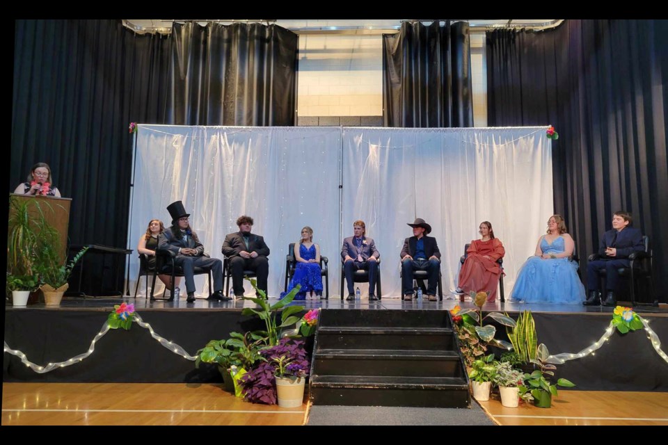 Principal Danielle Erikson (left) brought a message of congratulations and hope for future success for graduates (left to right) Marshall Willier, Gabriel Goddard, RaeBecca Pashulka, Harlen Saskiw, Noah Jacula, Nelly Boese, Hellen Briggs and Lynyra Crossan.