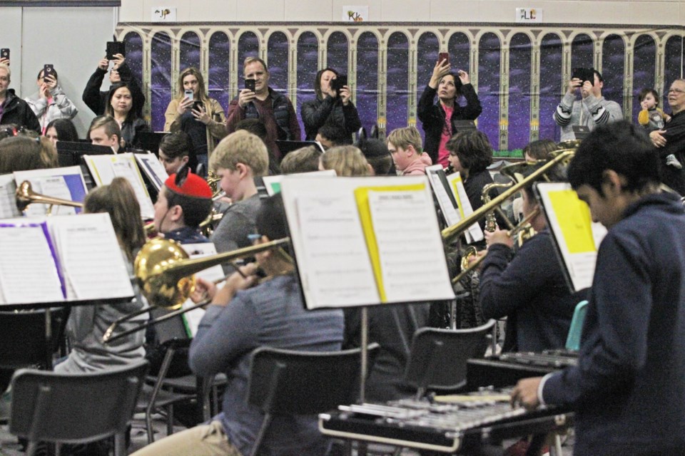 No pressure kids ... Family and friends line up with the phones and cameras during the Grade 6 Band Class performance.