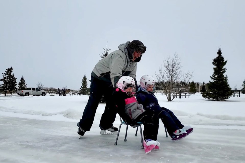 The Bernier family enjoys the new outdoor skating oval.