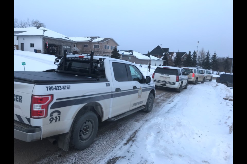 Police vehicles line the street along Trinity Blvd in the Beaver Lake hamlet (Young's Beach) on Friday. The initial complaint of a crime in progress was determined to be unfounded.     Image: Rob McKinley