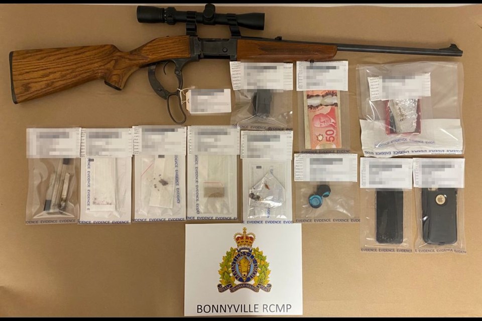 Officers seized drugs, a firearm, and electronics during a search warrant on May 12. 