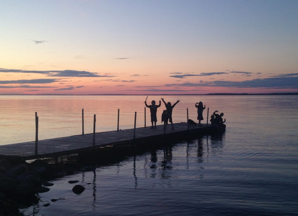 pic on dock water sunset