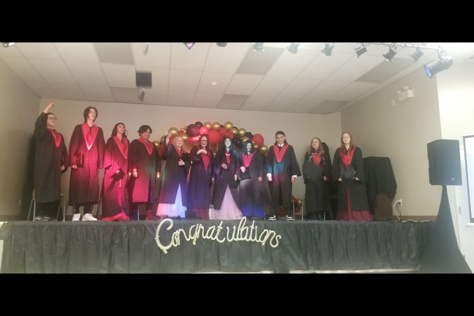 The Cold Lake Outreach School graduating class is pictured on stage.