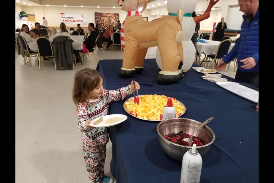 Children enjoyed pancakes and fruit during the pancake breakfast at 4 Wing.