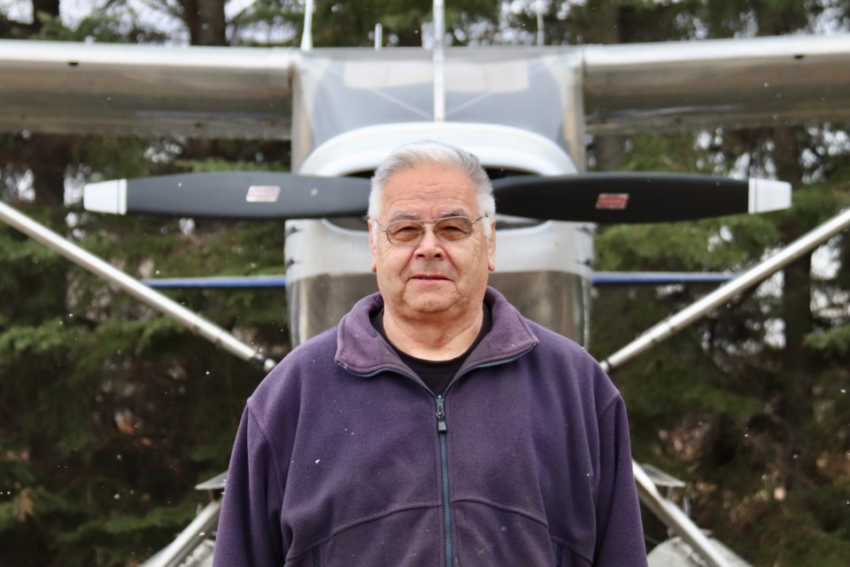 Steve Racette has been flying for over five decades. Here, he stands in front of his favourite plane, known to him as Liz. 