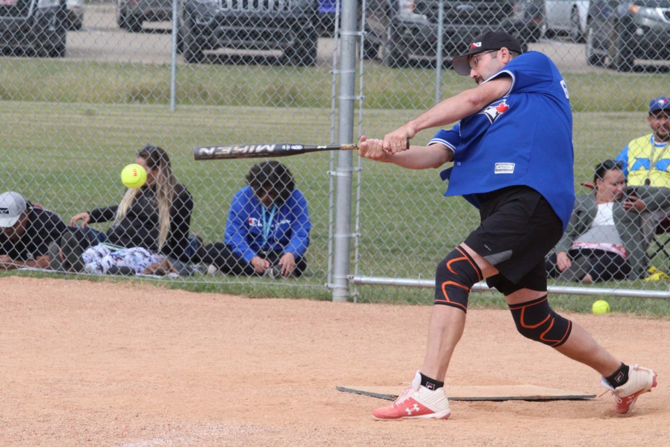 Jimmy Nashim hits a line drive during his team's Saturday afternoon game on the Plamondon diamonds.