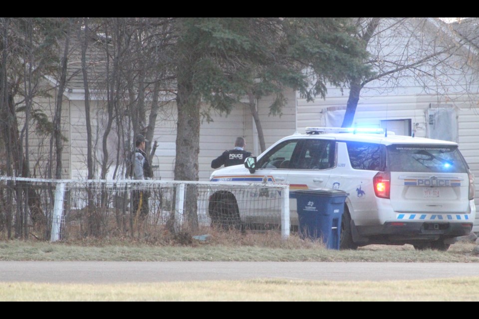 Lac La Biche RCMP survey the outside of a home on Tuesday afternoon, following up on a break-and-enter complaint.
