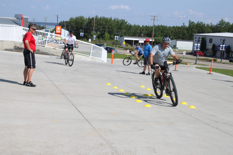 Cutline: From Tuesday to Thursday, six peace officers from Lac La Biche County and Red Deer participated in the bike qualification course at the Enforcement Services building in Lac La Biche. Over the three days, the officers were taught a variety of skills such as safe riding practices, arresting suspects while on a routine bike patrol as well as how to dodge rocks and other obstacles while on a trail or road and safely navigate traffic. Chris McGarry photos