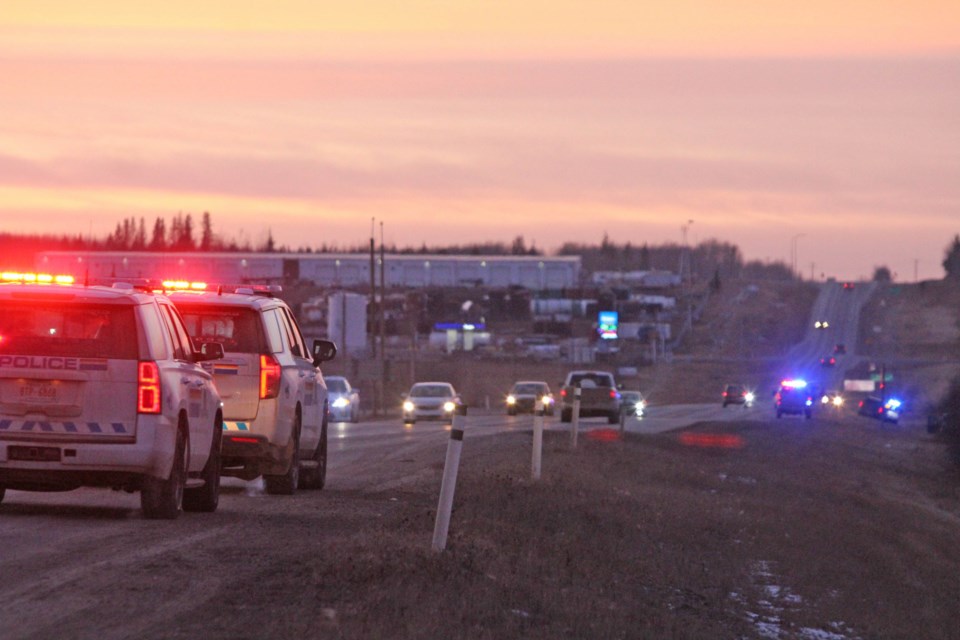 Two RCMP vehicles with lights flashing were part of more than a dozen first-responder vehicles along Highway 55 on Tuesday afternoon.