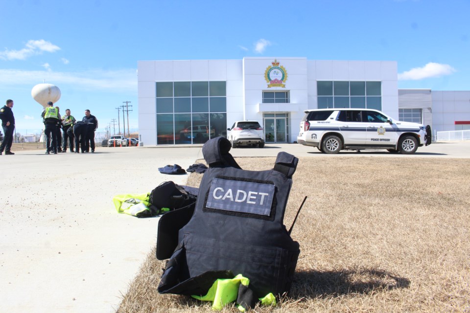 A cadet vest sits near the pavement at the Lac La Biche County Protective Services Building where trainees in the Community Peace Officer Induction Program were working on traffic stop procedures.