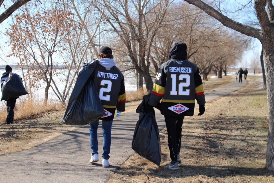 The Bonnyville Jr. A Pontiacs traded in their skates and hockey sticks for plastic gloves and garbage bags, picking up litter around town on Monday, March 23. Photo by Robynne Henry.