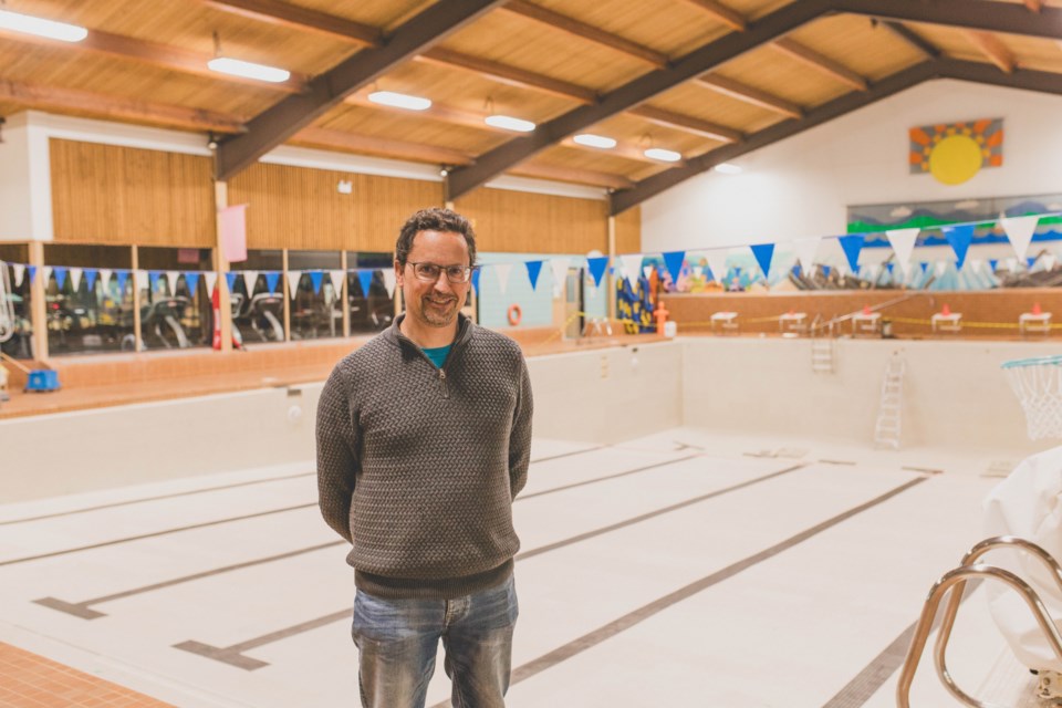 Robert Simons, manager at the St. Paul Aquatic Centre, stands in front of the large empty pool during this year's annual shutdown.