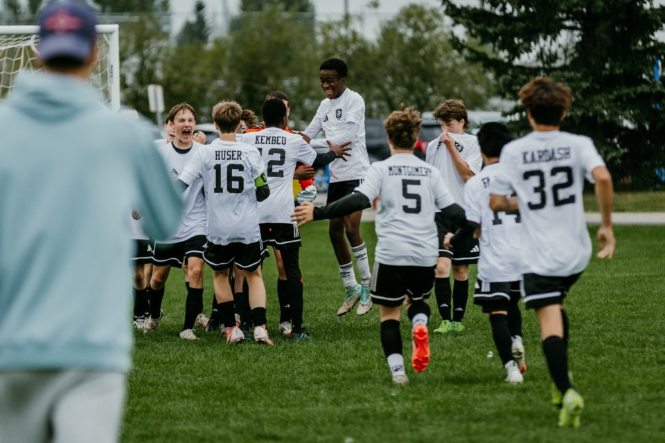 The U15 boys celebrate their semi-final win, earning them a spot in the gold medal finals.