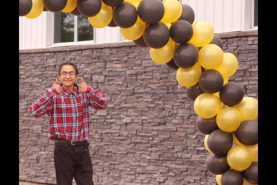 Raymond Hope gives the thumbs up on his graduation from Lac La Biche Regional Outreach Schools.