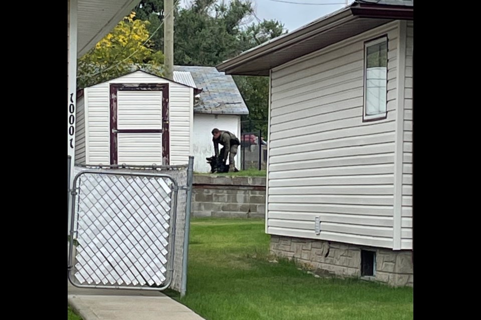 A PDS team works on a training scenario near a residence along 100 Street in Lac La Biche on Wednesday afternoon. 