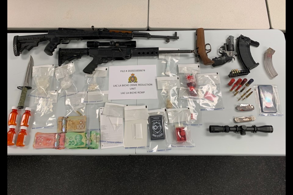 RCMP say they seized these items in a Dec. 17 arrest that has resulted in an area man facing 42 charges.    RCMP Supplied