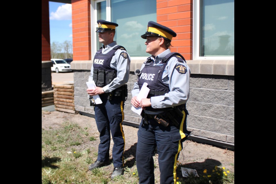S/Sgt. David Graham and S/Sgt. Sarah Parke spoke at a press conference about an incident involving a stolen trackhoe damaging five RCMP vehicles.