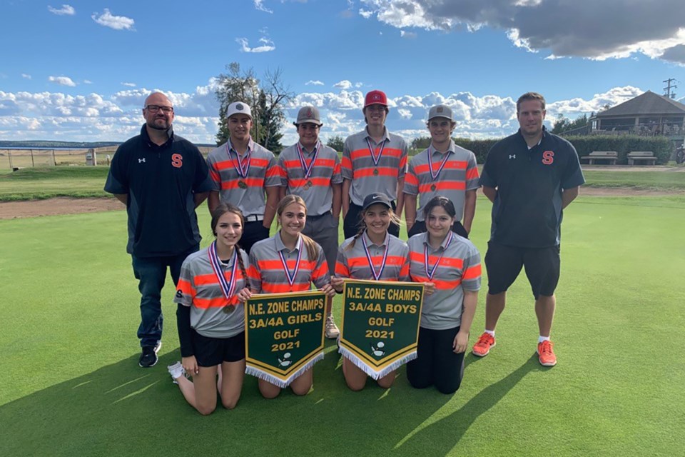 St. Paul Regional High School students pose with their north east zone 3A/4A banners following a day of golf in St. Paul on Sept. 13.