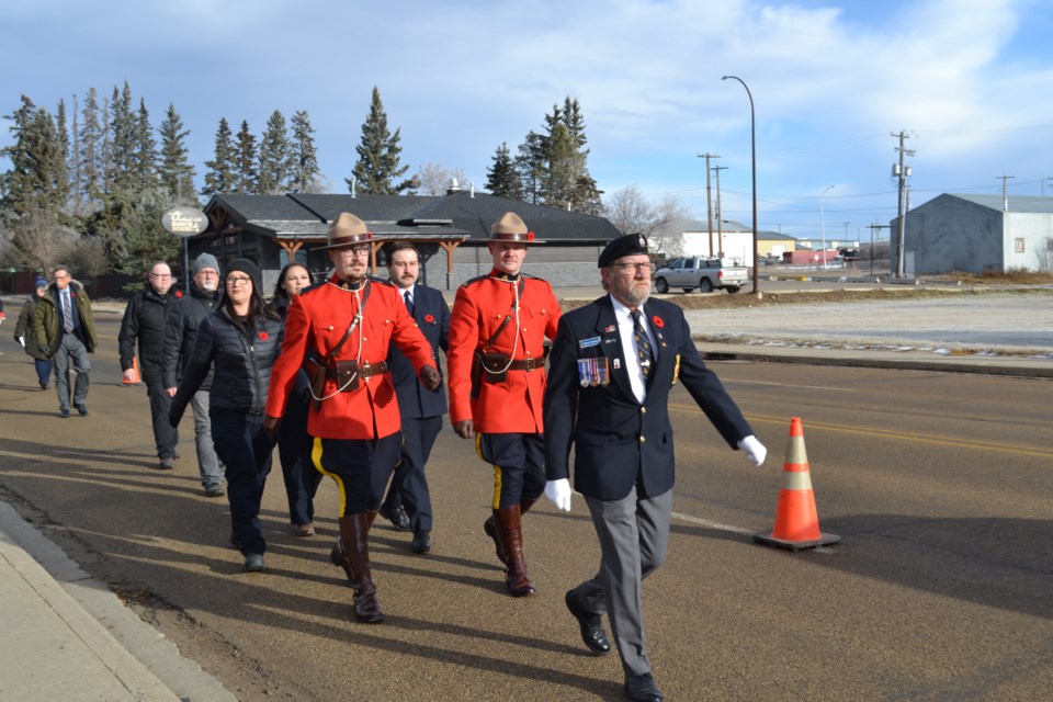 Royal Canadian Legion member Roger Freeman led Saturday’s Remembrance Day parade of organizations and individuals to Elk Point’s cenotaph for the outdoor ceremony. / Vicki Brooker photo