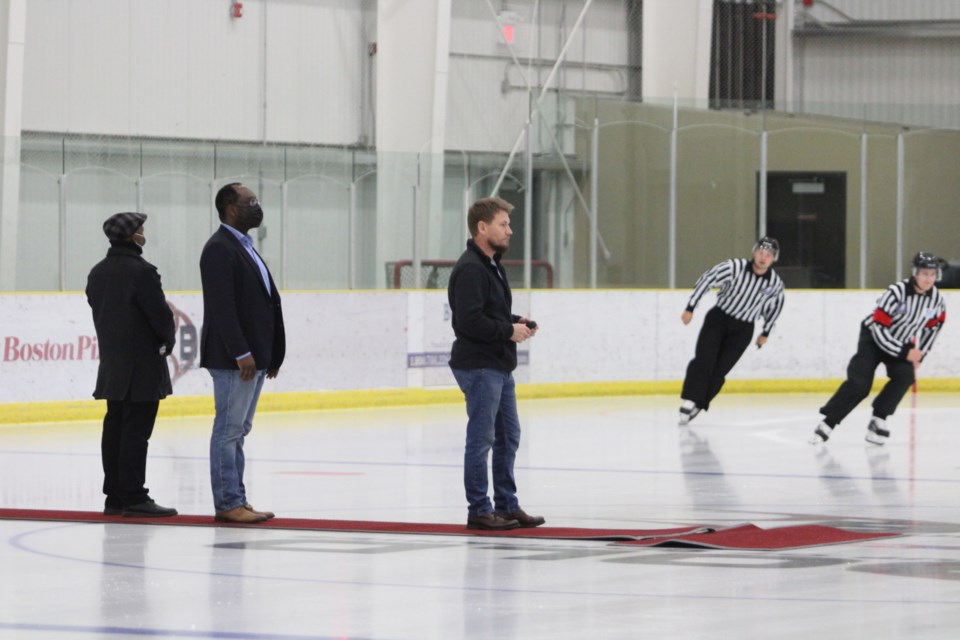 Two minutes for red-carpet standing:  Referees in their pre-game skate check out the centre-ice guests for Friday's ceremonial puck drop to start the Voyageurs's 2021-22 season.