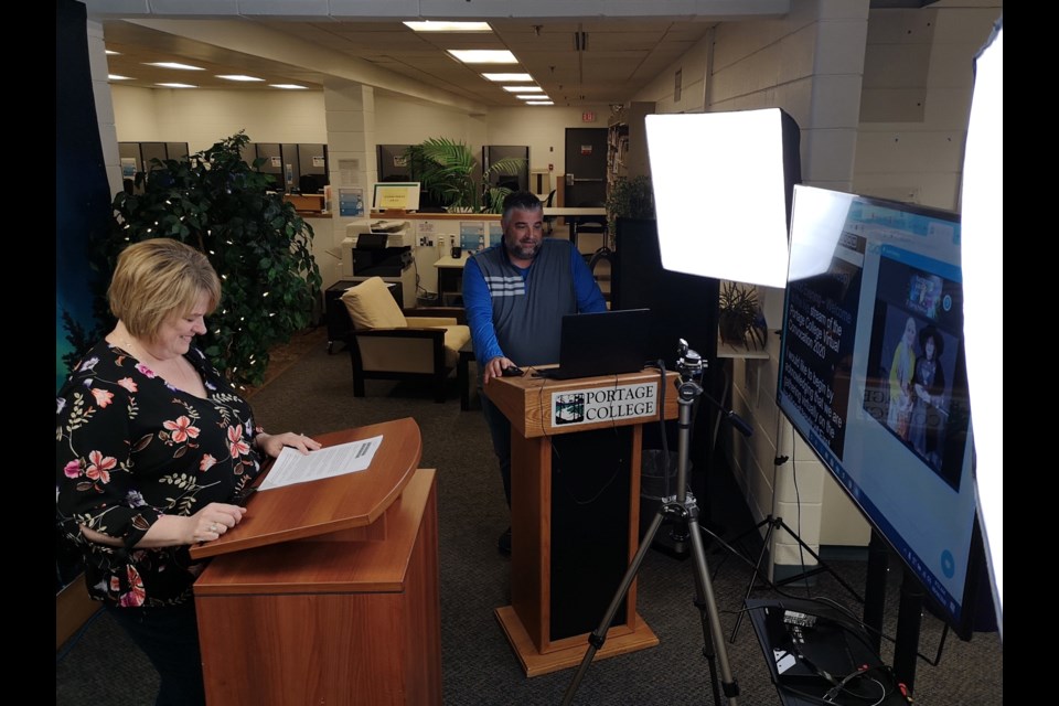 Portage Community Relations manager Rick Flumian and vice-president of Planning and Public Relations Carrie Froehler pre-tape segments for Friday's Portage College convocation ceremony.