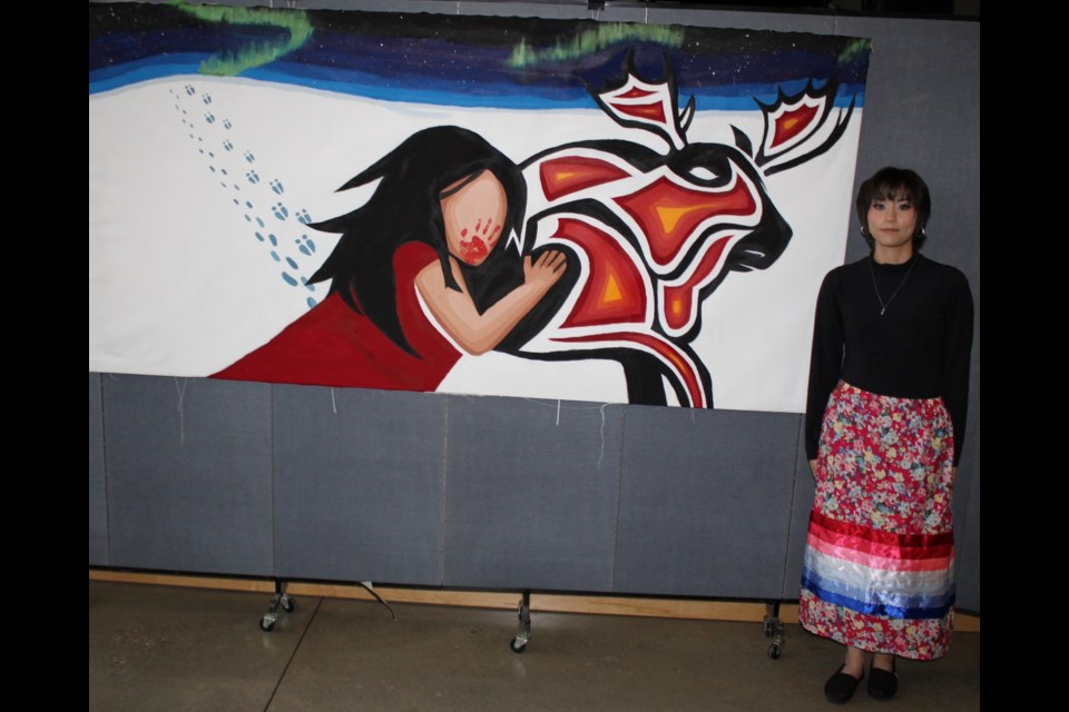 J.A. Williams Grade 11 student Riley Gladue with her impactful art.