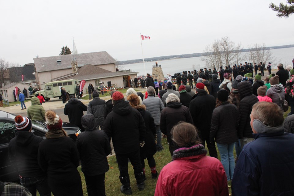 Crowds of residents line the road at the Lac La Biche Legion for the Remembrance Day ceremony. This year, the normally busy parade area saw an absence of troops from theneighbouring CFB Cold Lake.