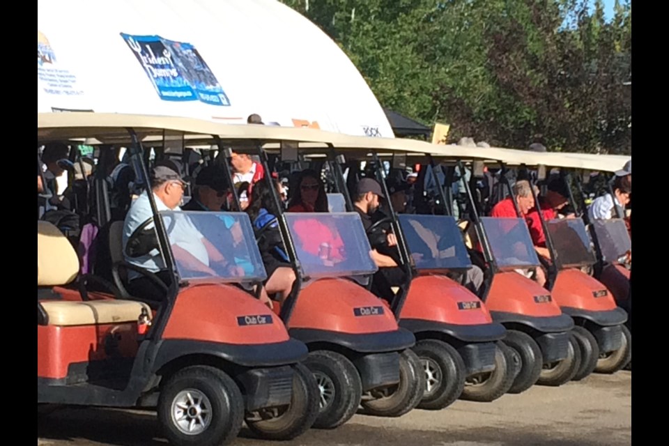 Some of the 144 golfers get set to roll at the start of Thursday's Road To Hope annual golf fundraiser at the Athabasca Golf Club
