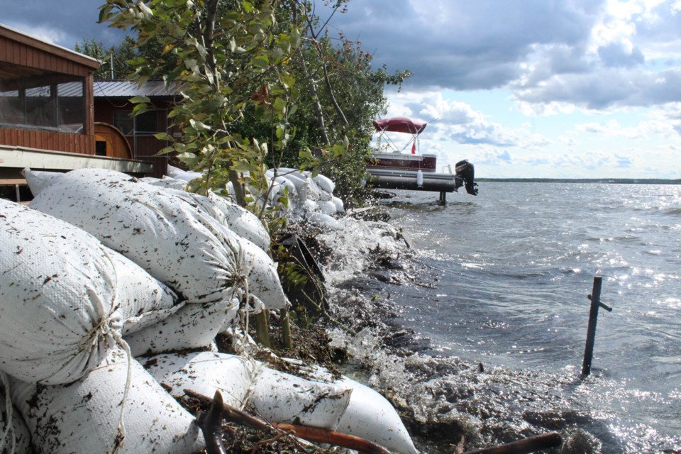Residents have been forced to use sandbags along several lakeside subdivisions as water levels of Lac la Biche lake continue to threaten the shoreline.    Image: Rob McKinley