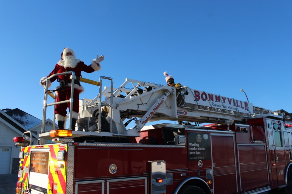 Santa Claus was escorted through town by the Bonnyville Regional Fire Authority to ensure everyone’s safety. Photo by Robynne Henry.