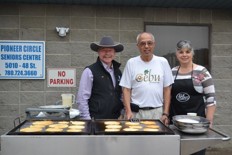 Mayor Parrish Tung and his helpers, County of St. Paul Coun. Kevin Wirsta and Town of Elk Point Coun. Wanda Cochrane started off Seniors Week around the pancake grill at the Town of Elk Point’s annual Seniors Week pancake breakfast.
