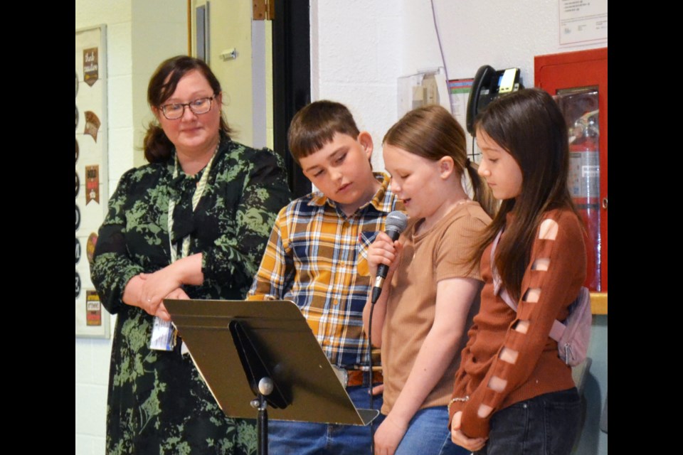 Performing Arts teacher Stephanie Earle introduced MCs Jacob Prymak, Aspyn Kelly and Annabelle Rogucki to start the Showcase performance.