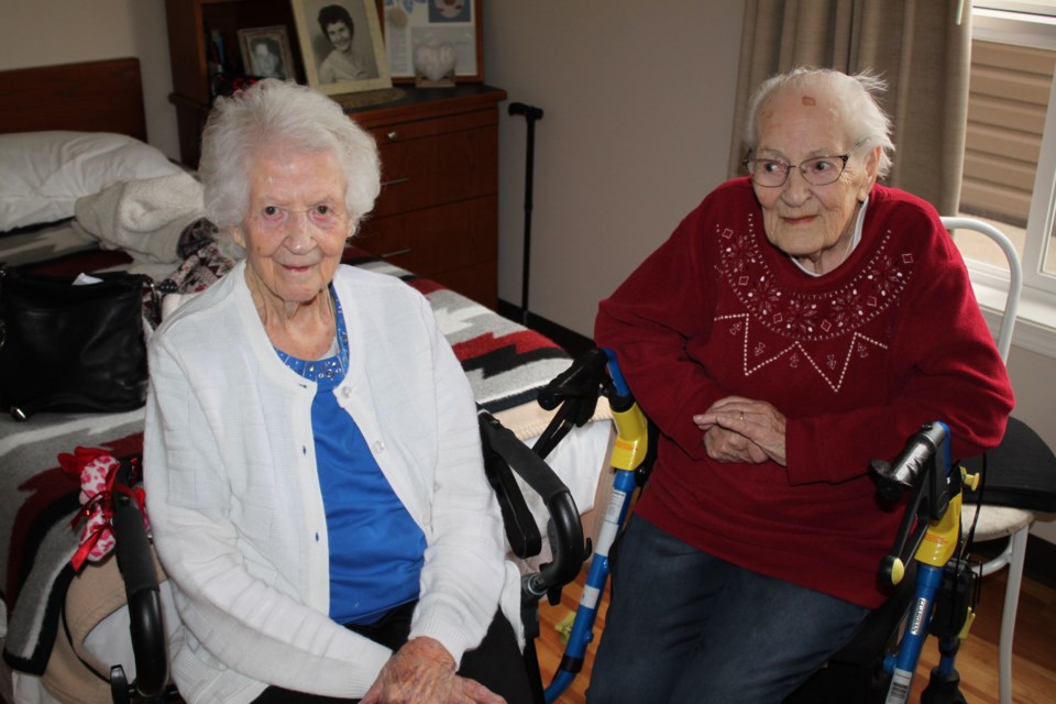Centennial sisters: (right) Mary Senetza, 100, and her older sister Dorothy Switz, 102, recently reconnected at Lac La Biche's LacAlta Lodge. 