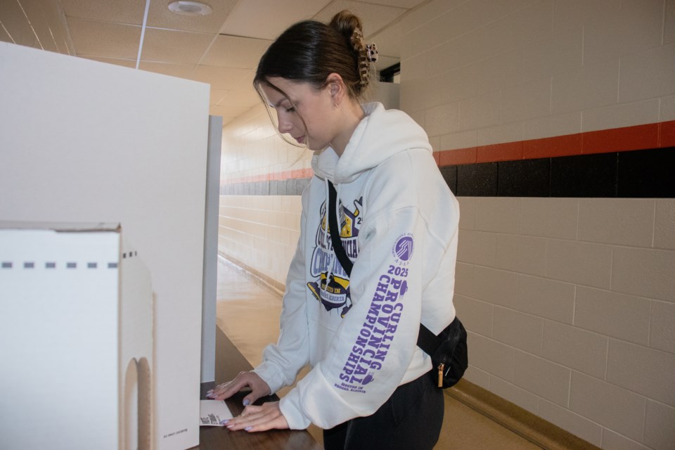 Chloe Jean, a Grade 12 student at St. Paul Regional High School, participates in the Student Vote.