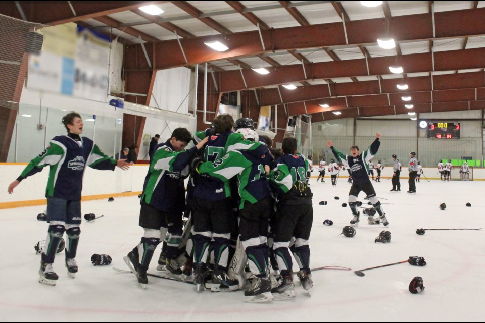 Springbank Rockies players celebrate their provincial title win in the Plamondon Arena after Sunday afternoon's 8-3 win over theTrails West Wolves.