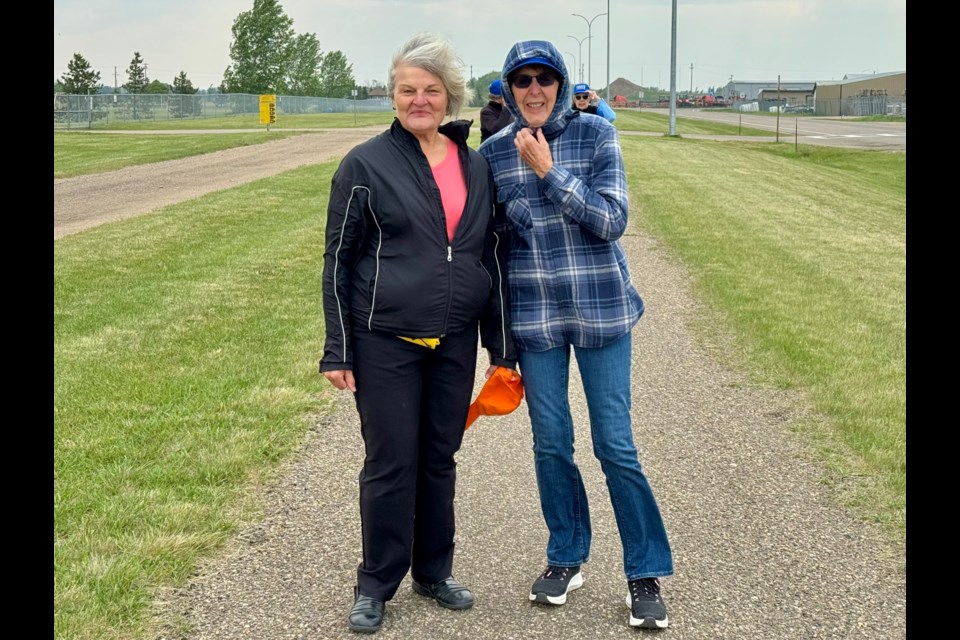 Marie Leslie and Barb Tchir take part in a walk that brought retired teachers together, June 7.
