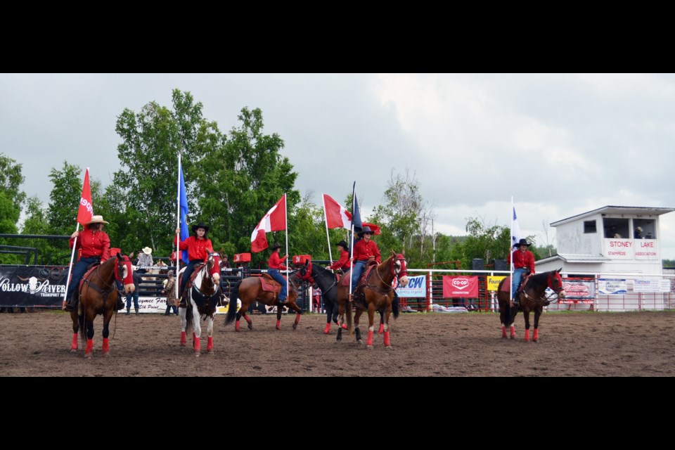 The Stoney Lake Riders demonstrated their well-practiced moves to the singing of O Canada as the last few raindrops fell at the beginning of the July 6 performance.