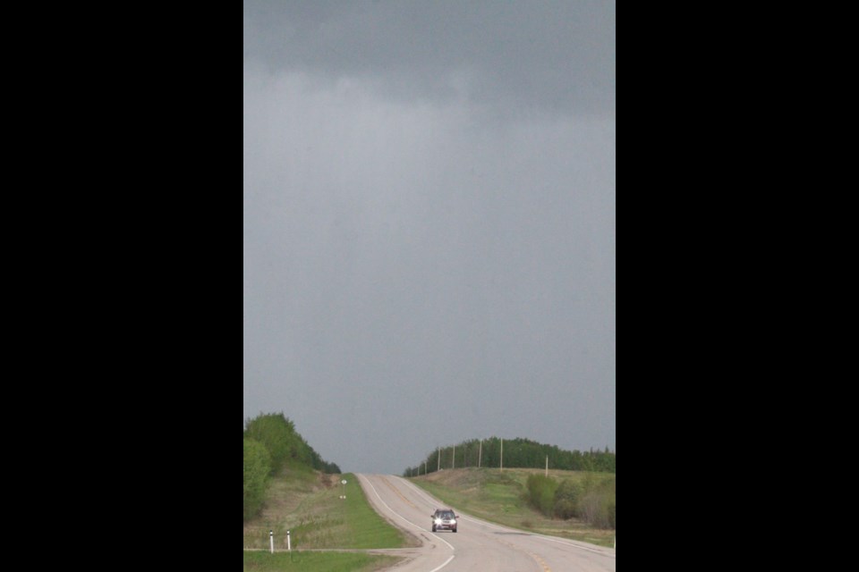 Stormy skies over Highway 55 near Iron River last week were a repeat of the last few weeks of weather over the Lakeland.
