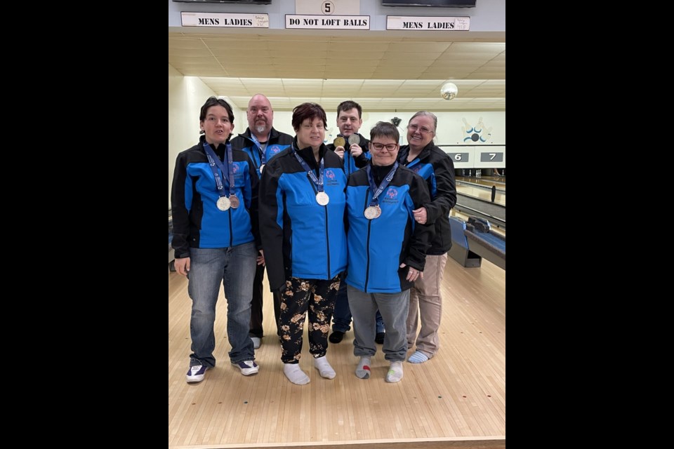 The St. Paul Special Olympics bowling team poses for a picture. The group brought home silver medals for their team efforts. 